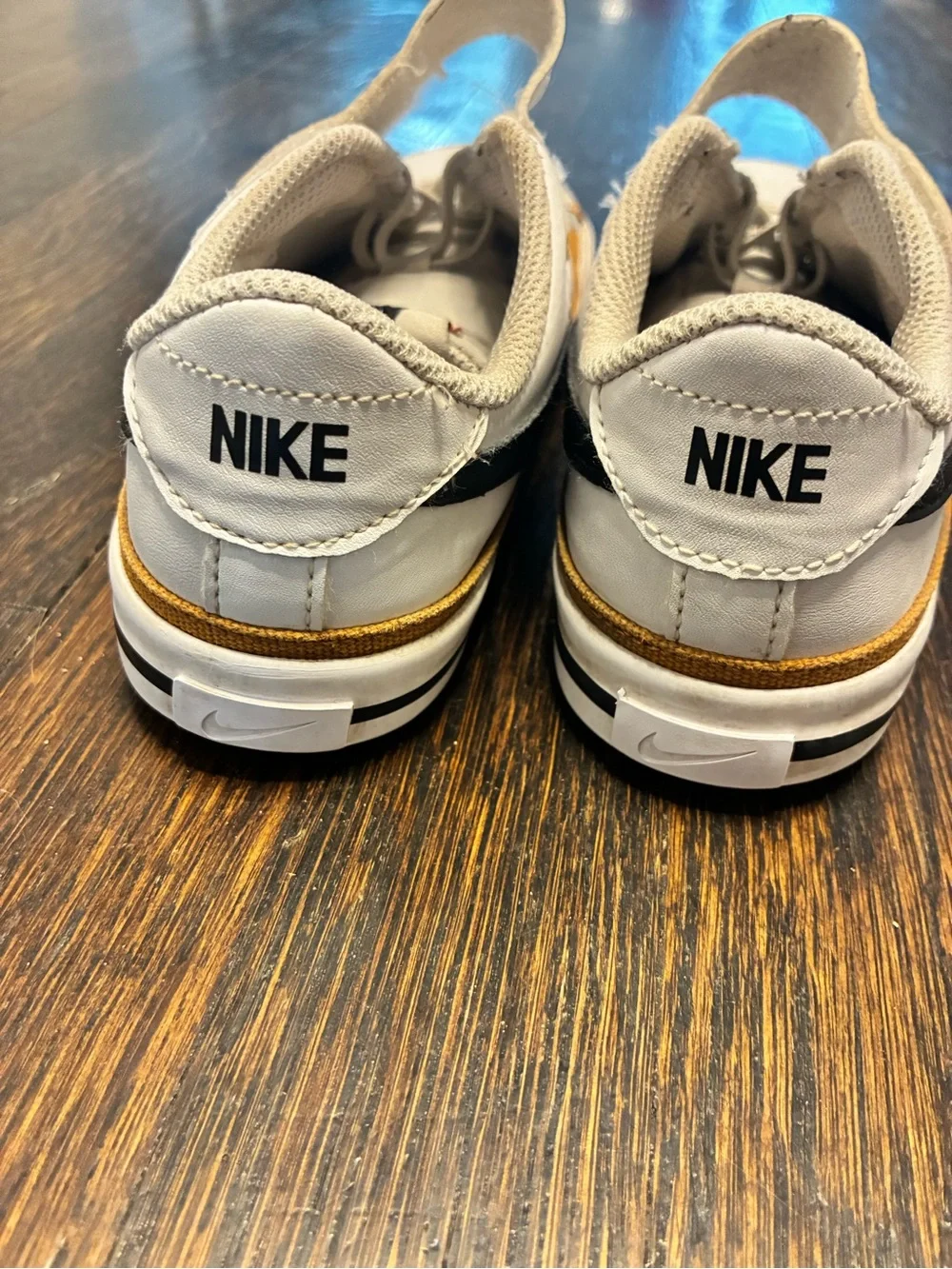 Nike Kids White Sneakers with Black Swoosh and Tan Trim